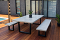 Concrete Outdoor table and bench seats on black steel frame